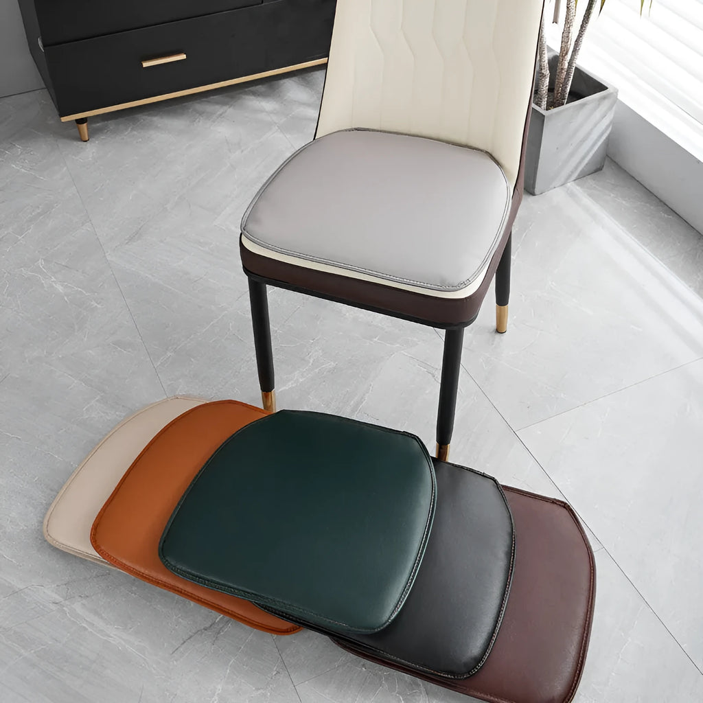 Brown leather horseshoe-shaped seat cushion on a wooden chair, showing non-slip base.