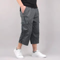 Men's loose fit cotton cropped casual pants in khaki colour on a neutral background.