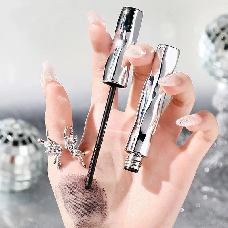 Waterproof long thick mascara in a steel tube with black and brown colour options, shown with an eyelash curler.