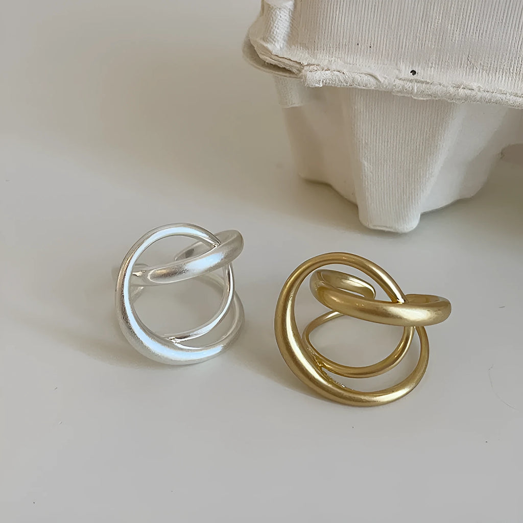 Three-dimensional interlaced geometric open ring with matte metal finish