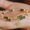 Women's bamboo beaded bracelet with coloured glaze in plum wine colour C208
