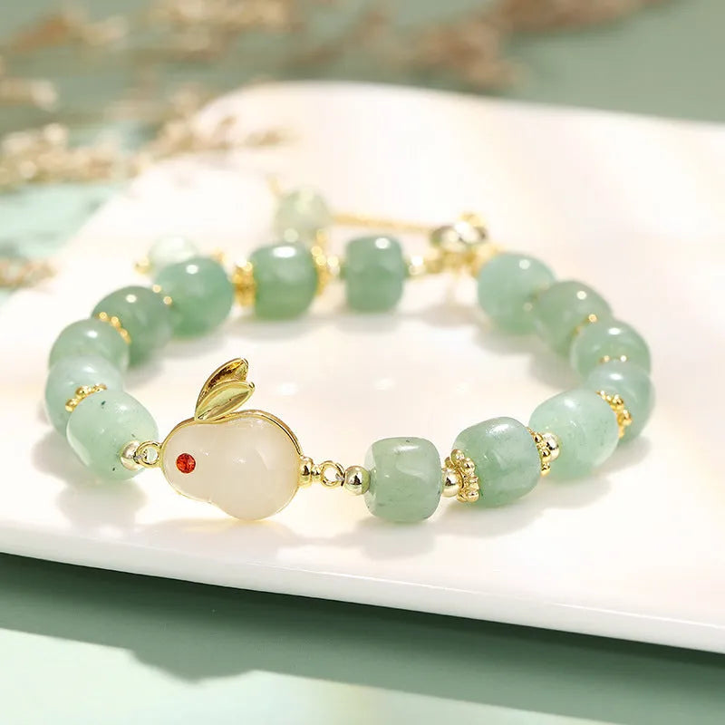 Rabbit charm bracelet with green aventurine or strawberry quartz stones on gold-plated chain