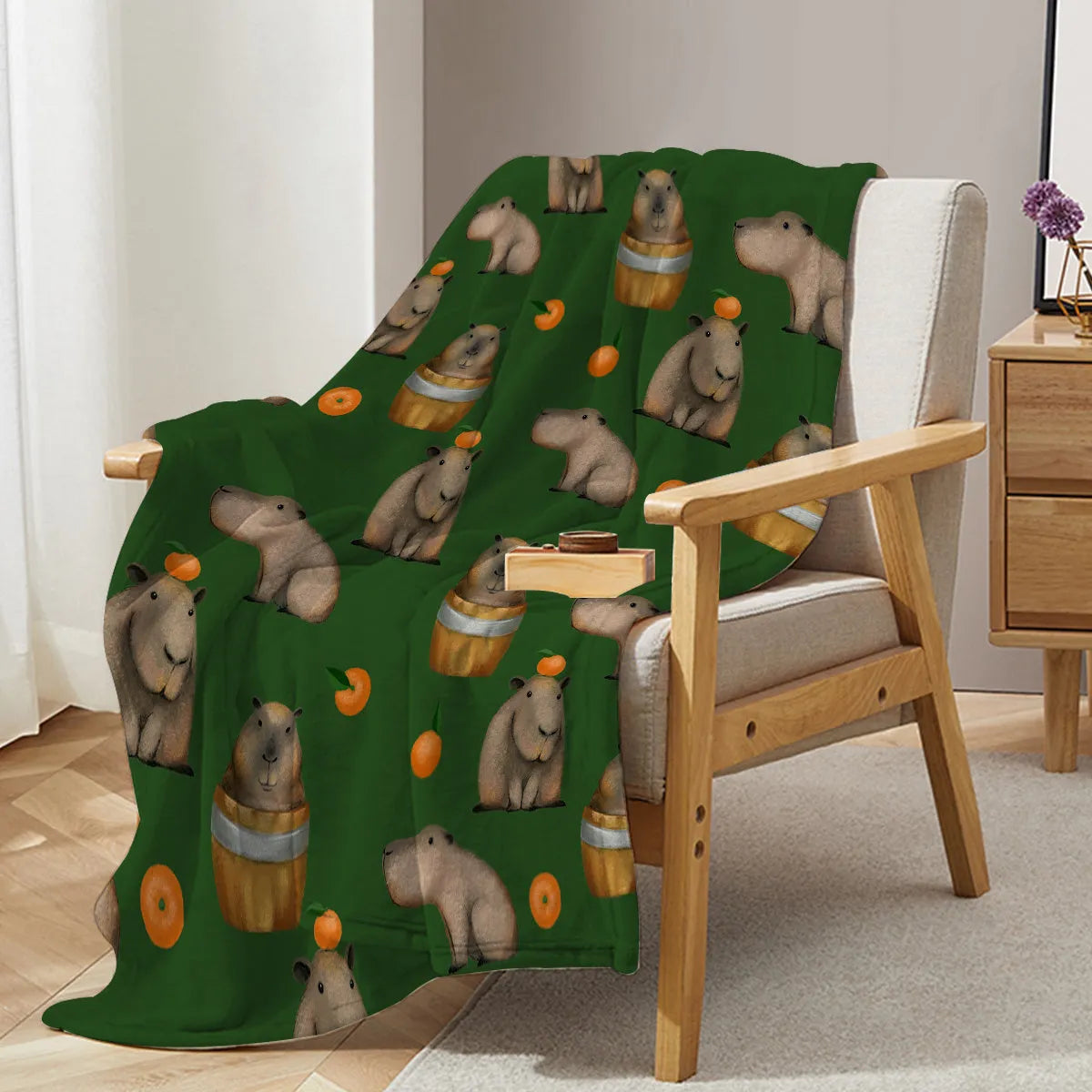 Flannel fleece blanket with orange capybara print, soft fluffy throw in three sizes with hemmed edges.