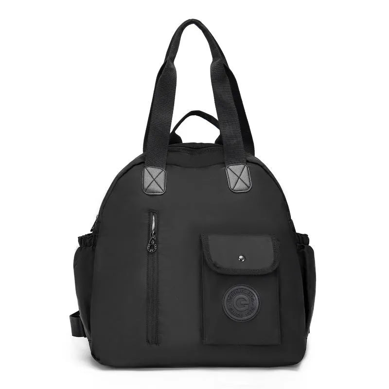 Large lightweight nylon backpack in black, khaki, or green with front sandwich pocket.