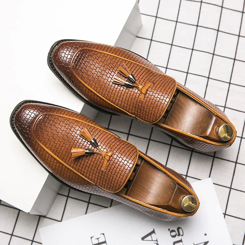 Men's black pointed toe slip-on business shoes with tassel detail on artificial PU upper