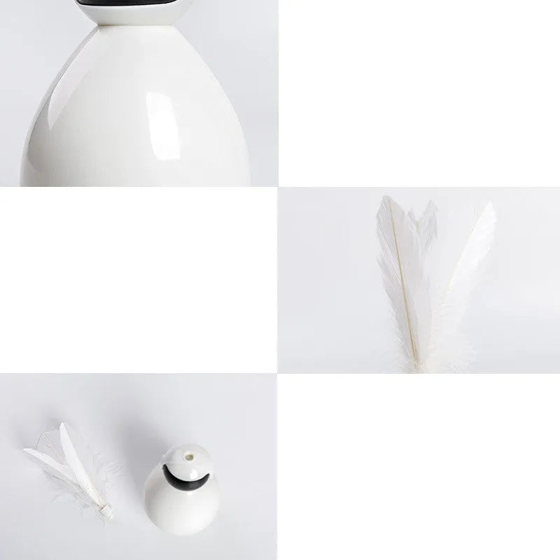 ABS tumbler cat toy with feather attachment and 3 feather replacements in white, yellow, and pink