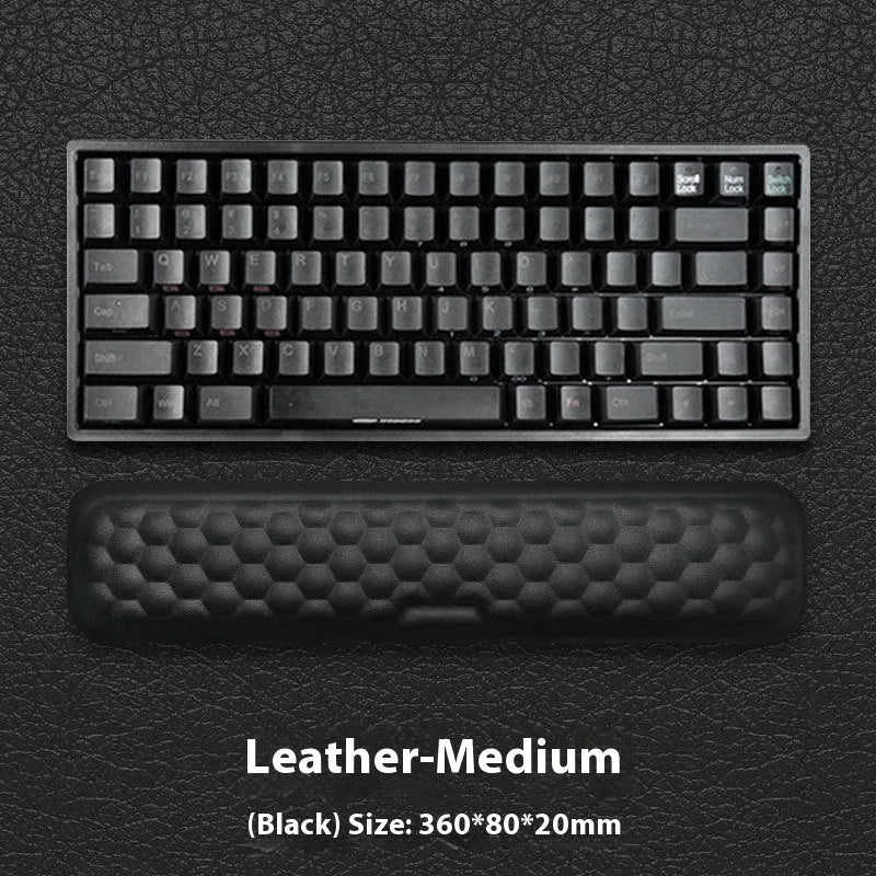Memory foam mouse wrist pad with silicone bottom in black cloth cover on computer desk
