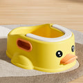Duck-shaped blue PVC bathtub for washing dogs and cats on grass