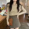 Beige viscose knitted long-sleeved cardigan with loose fit design on hanger