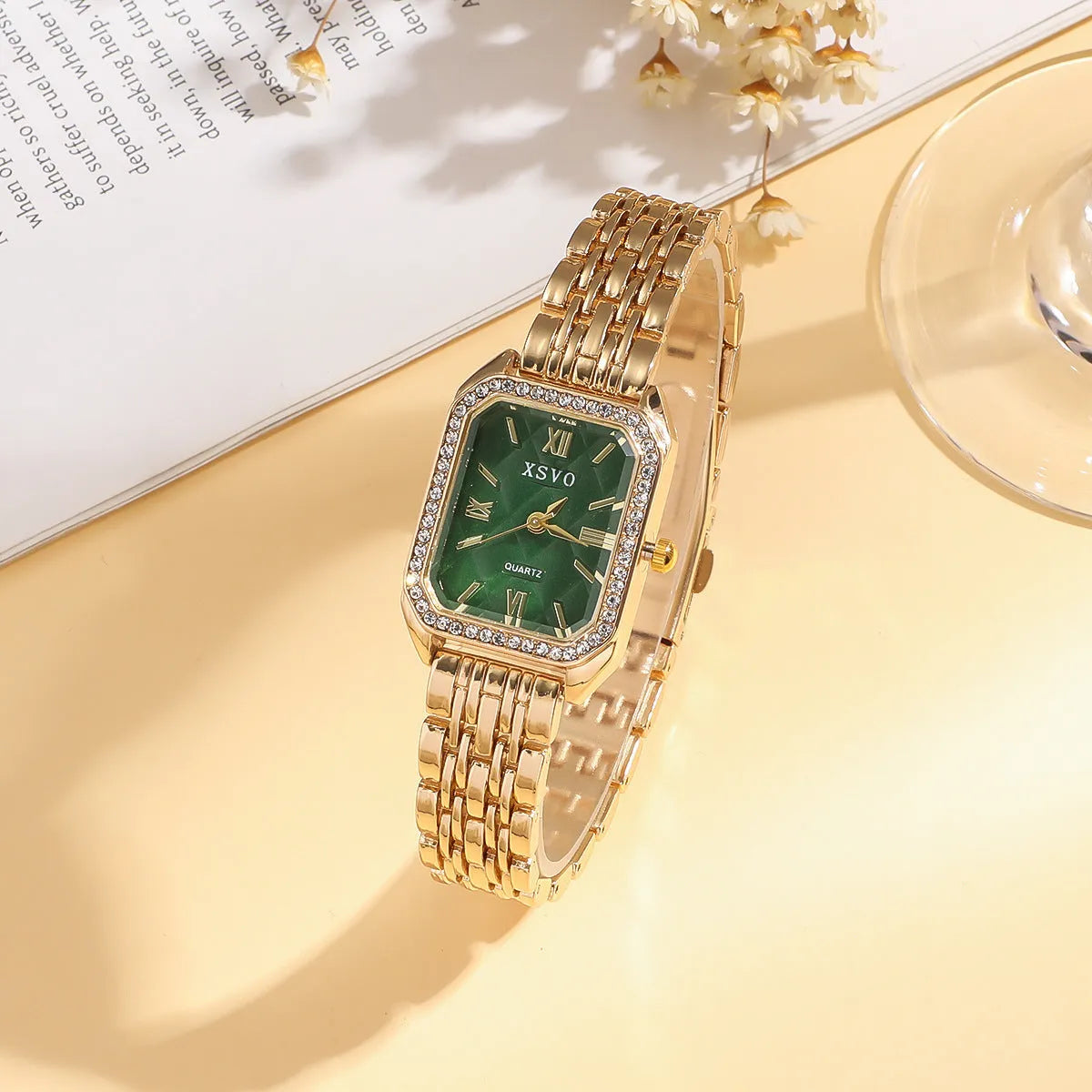 Gold green square watch with alloy case and four matching bracelets laid out showing jewellery buckle and spiral crown
