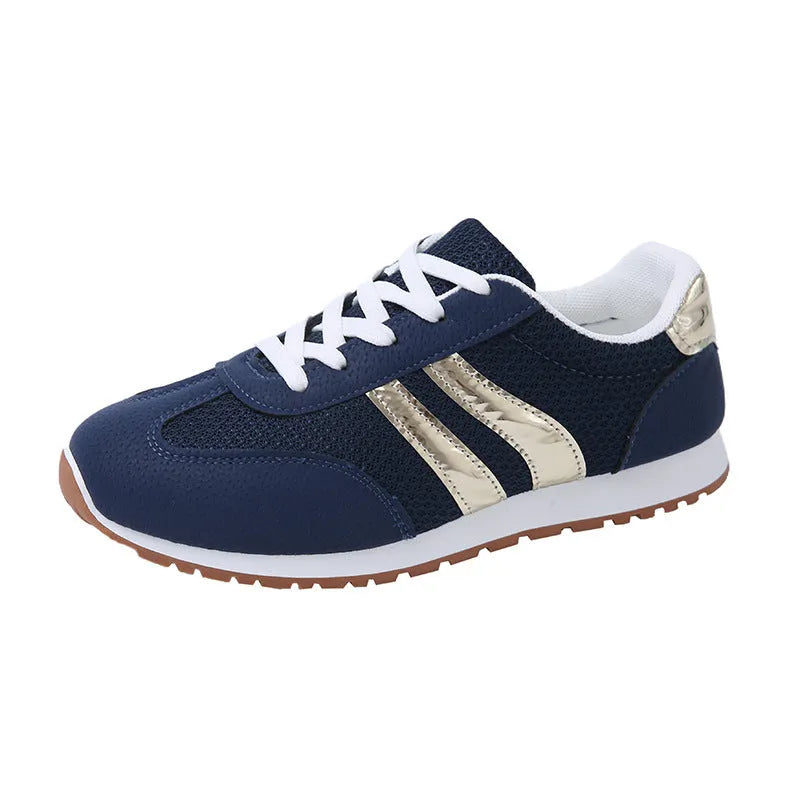 Blue women's casual tennis shoes with cross straps and a white rubber sole.