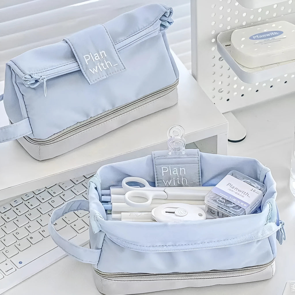 Dark blue folding double-layer polyester pencil case for students, also shown in blue and cream white.