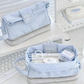 Dark blue folding double-layer polyester pencil case for students, also shown in blue and cream white.
