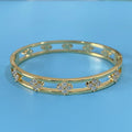 Women's hollow bracelet with four-leaf clover charm and zircon inlay in gold or silver colour