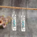 Long strip silver earrings with geometric shape and turquoise colour inlay