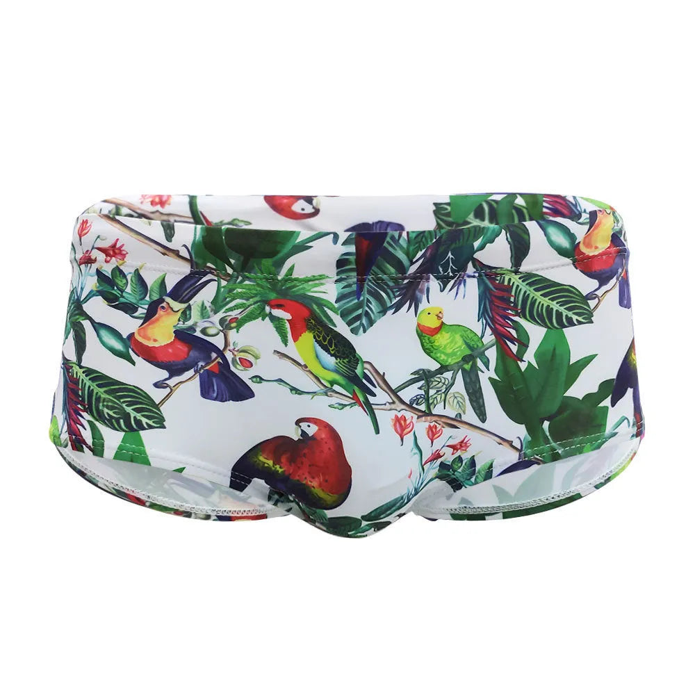 Men's navy swim trunks with colourful flower and bird print pattern, boxer style