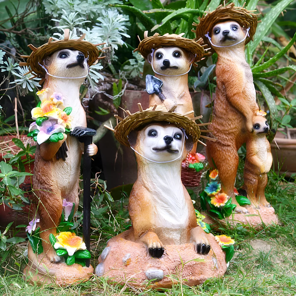 Yellow brown synthetic resin mongoose garden ornament wearing a straw hat and holding a rake or shovel for bonsai decoration