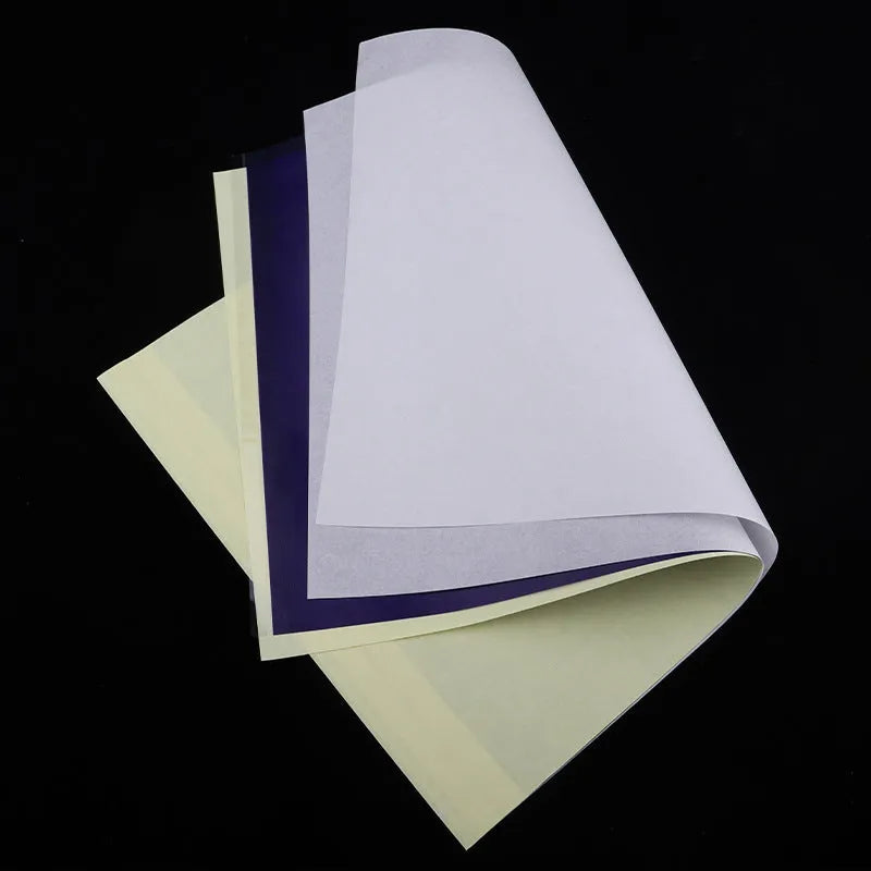 Stack of A4 tattoo transfer paper sheets showing quadruple copy layers for stencil making