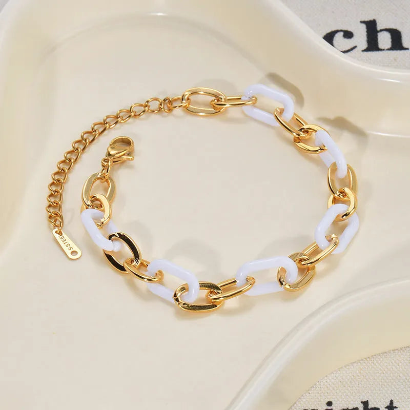 Double-layer heart-shaped stainless steel resin bracelet for women with electroplated finish.