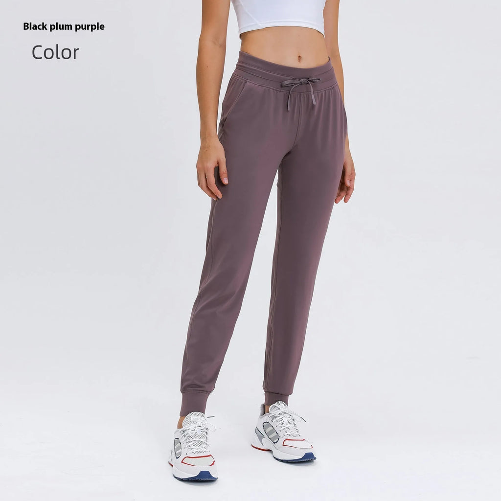 Women's high waist yoga pants with drawstring waistband in quick-drying cotton blend fabric
