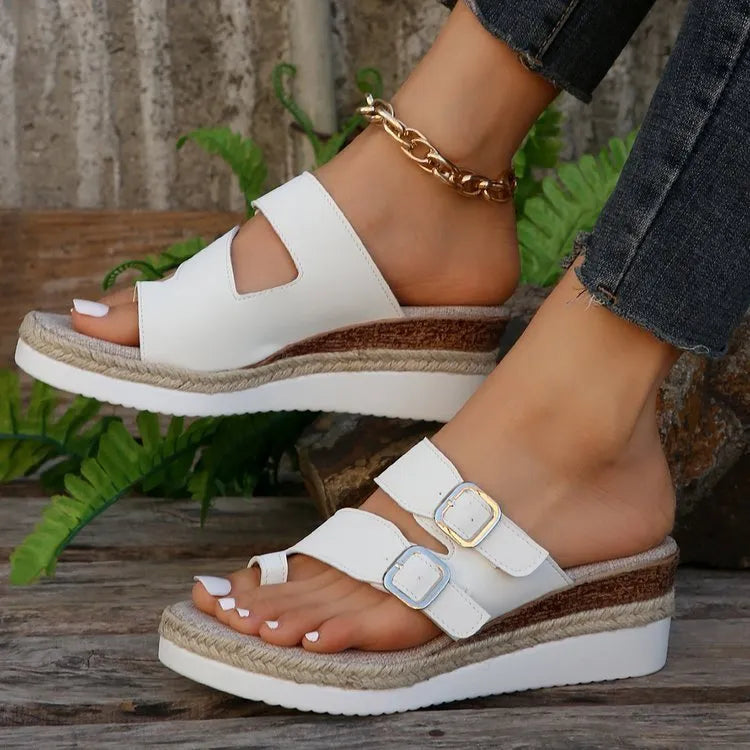 White patent leather wedge sandals with finger-fit design and woven detailing