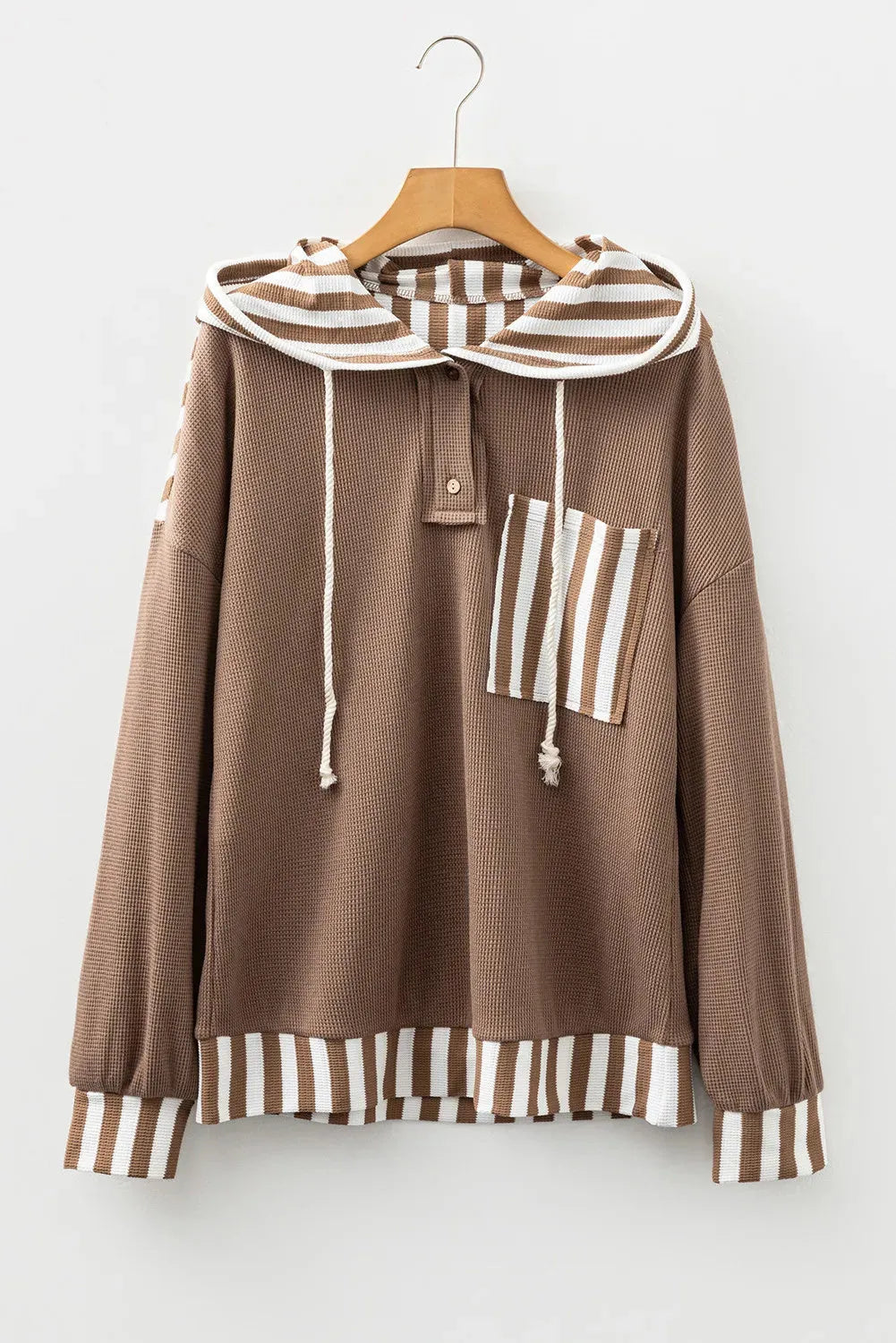 Straw yellow waffle texture hoodie with patchwork stripes, drawstring hood, and button neck detail