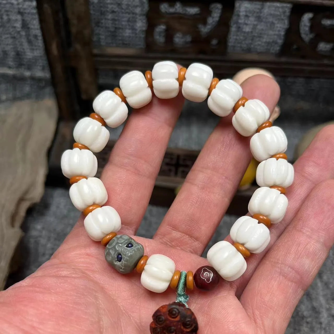 Carved bodhi root pumpkin lotus bracelet with white jade beads and mixed sizing