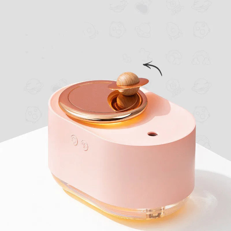 Rotating planet USB humidifier with night light in green colour showing mist output
