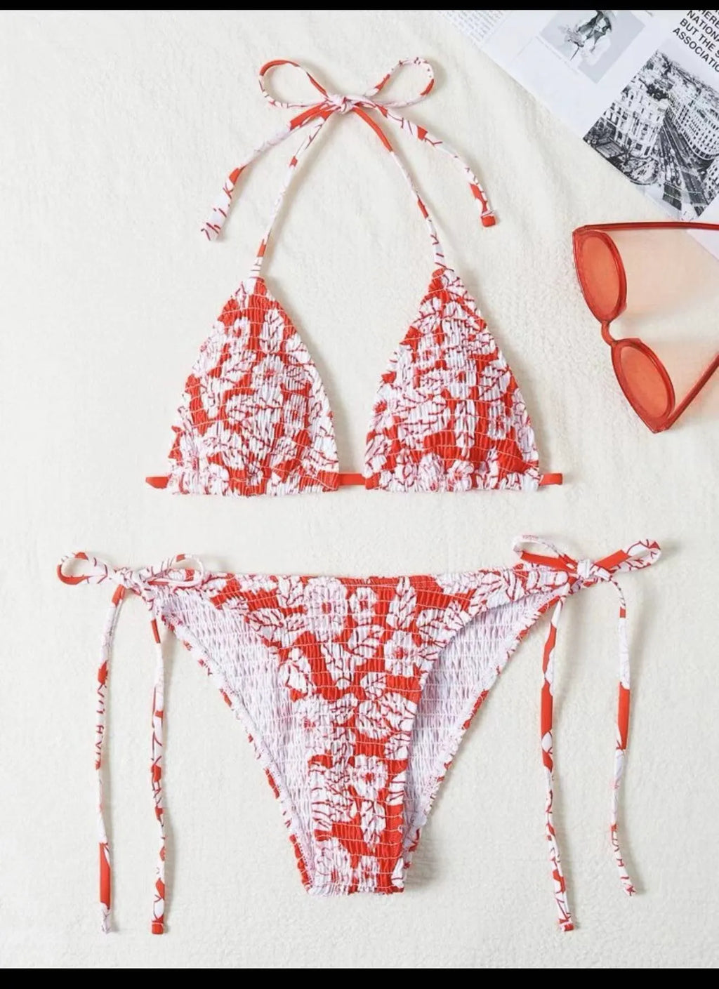 Women's floral print halter bikini swimsuit in light blue colour on a mannequin.