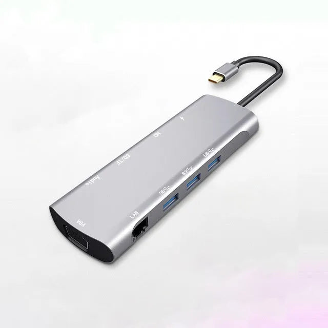 Grey aluminium USB-C docking station with HDMI, VGA, USB 3.0, and PD charging ports