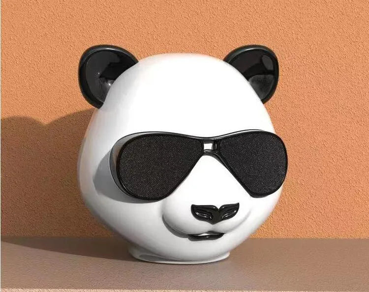 Classic style portable mini Bluetooth speaker showing front grille and likely a USB charging port.