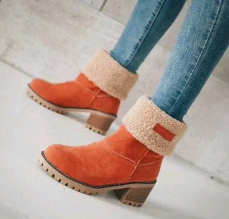 Women's black suede mid-calf snow boots with a round toe and flat low heel.