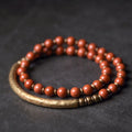 Layered ethnic bracelet in natural stone with brass detailing on wrist