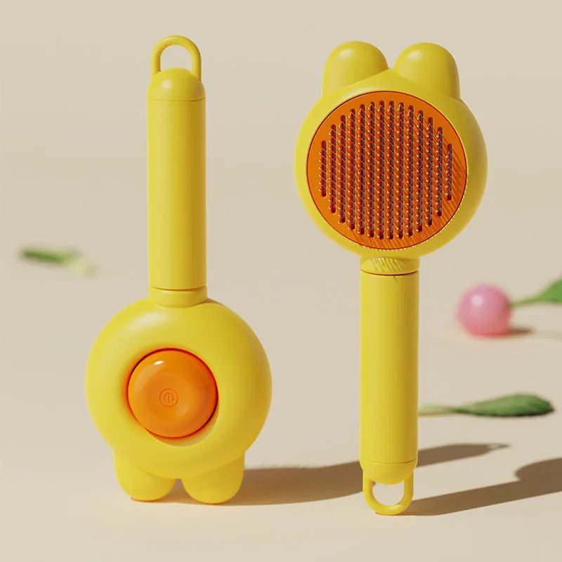 Self-cleaning pet grooming brush with coloured handle and stainless steel comb teeth with rubber tips