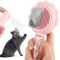Grey spray cat grooming brush with a release button and stainless steel bristles on a wooden table.