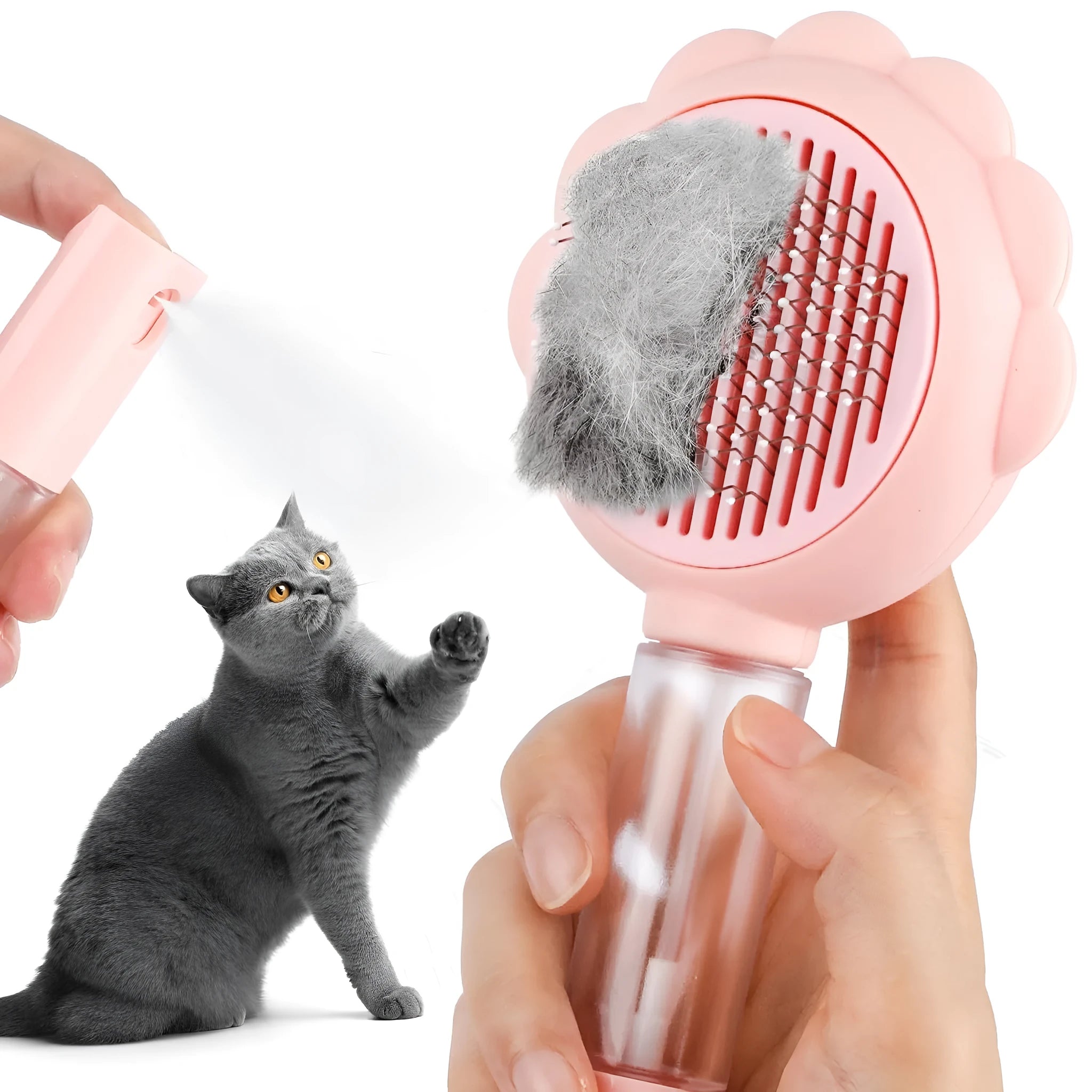 Grey spray cat grooming brush with a release button and stainless steel bristles on a wooden table.