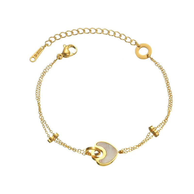 Double-layer heart-shaped stainless steel resin bracelet for women with electroplated finish.