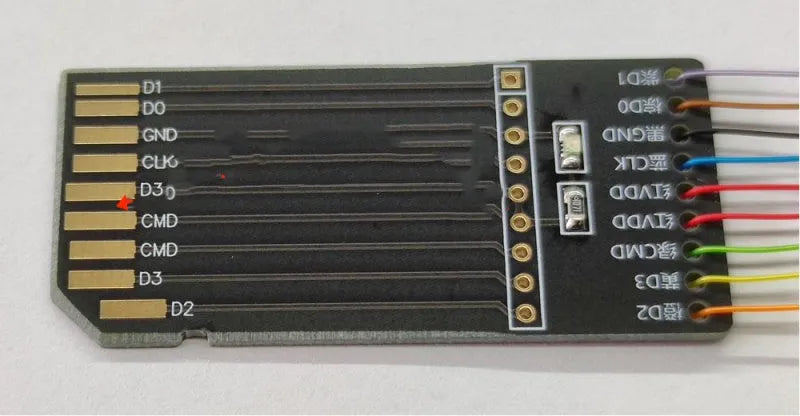 EMMC read and write tool for car audio host maintenance on a workbench.