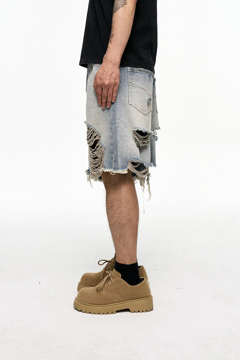 Light blue men's baggy denim shorts with wide leg and zipper fly