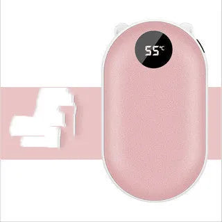 Compact rose gold rechargeable hand warmer and power bank with USB port on a table.