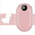 Compact rose gold rechargeable hand warmer and power bank with USB port on a table.