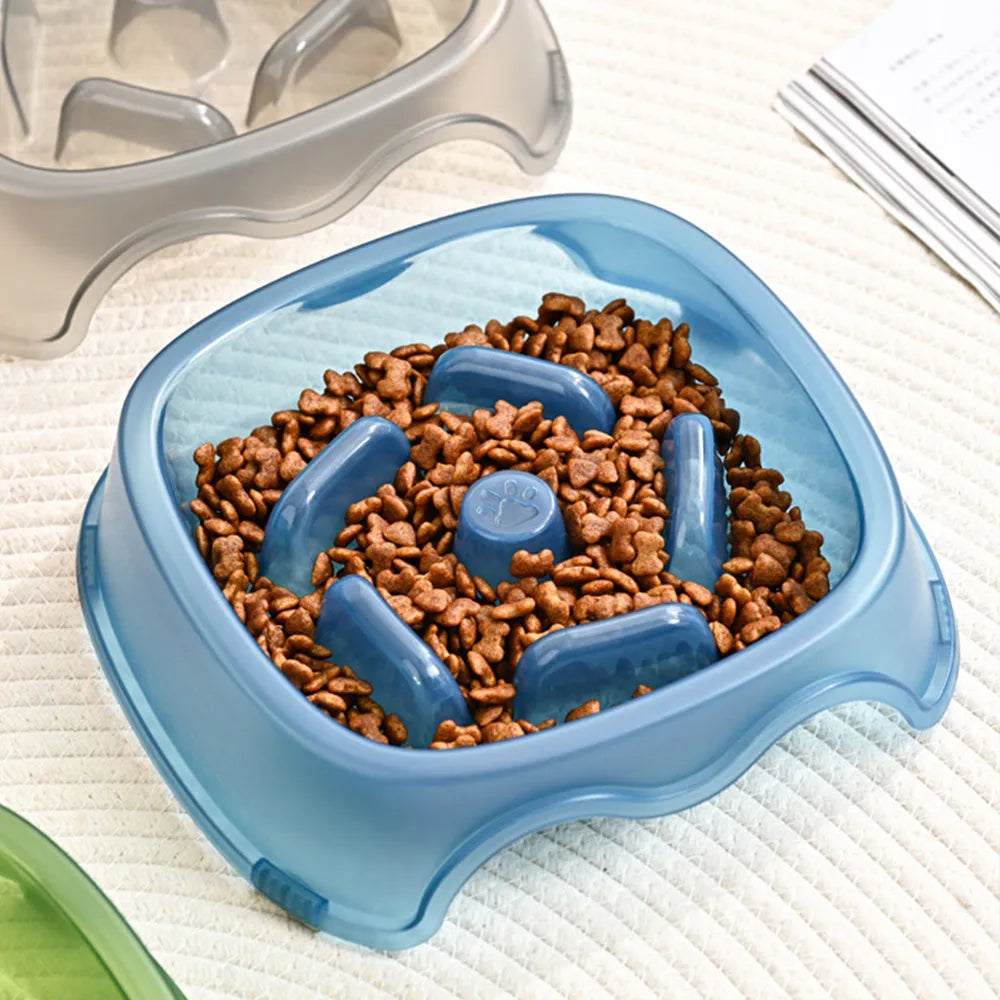 Blue slow feed anti-choke dog bowl with raised centre pattern on a non-slip base.