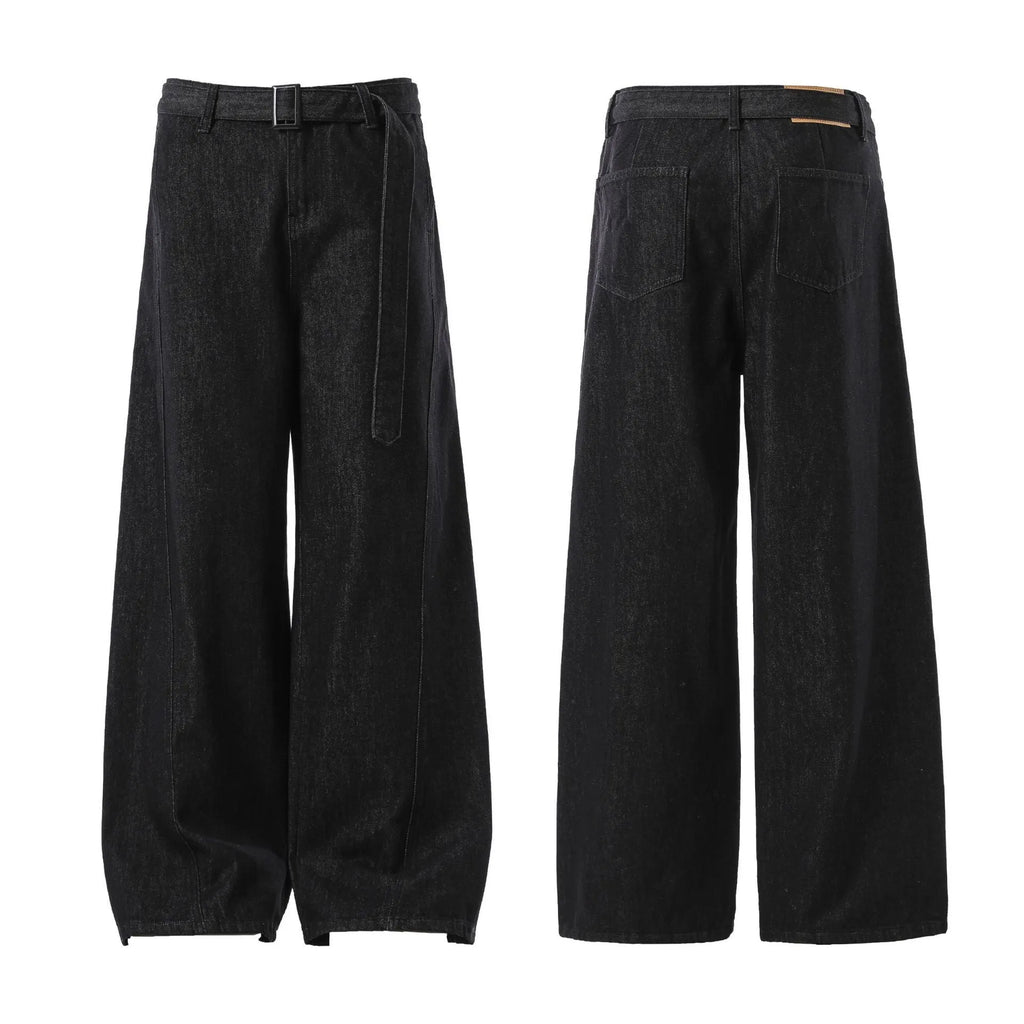 Black high-waist straight-leg jeans with gold details on a denim background.