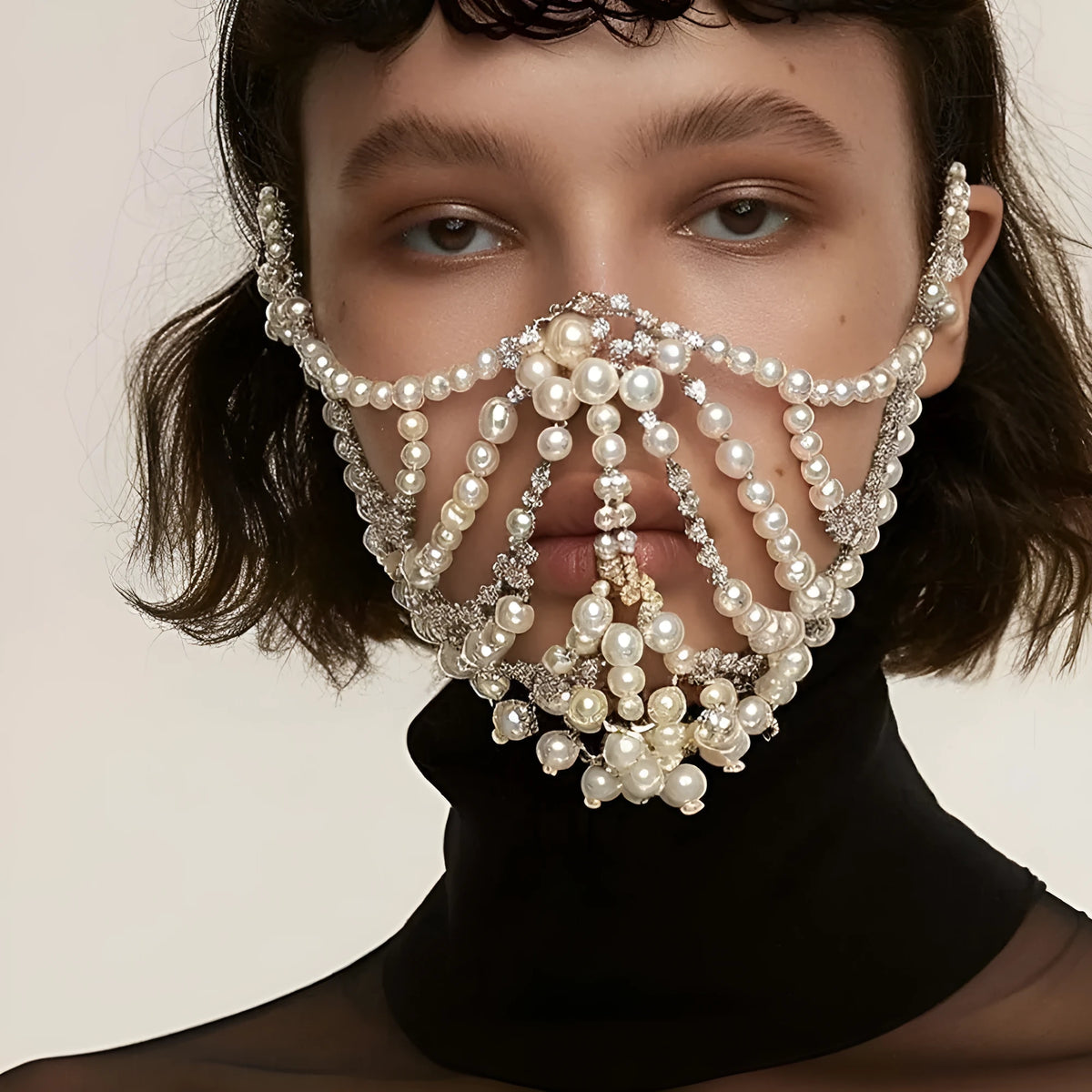 Geometric party mask with electroplated alloy frame and rhinestone patchwork in silver or gold colour