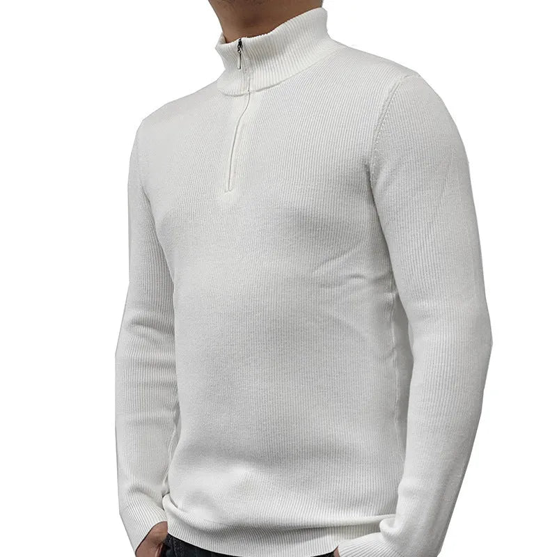 Man wearing a grey zip-up half-turtleneck sweater with long sleeves.