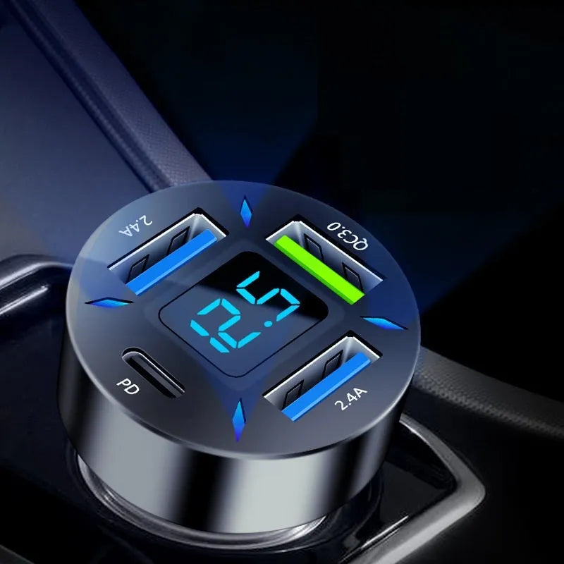 Black four-port USB car charger with LED digital display showing output voltage