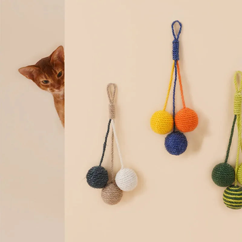 Cat toy set with teaser stick and colourful catnip balls on blue background