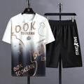 Men's light grey summer tracksuit consisting of a short sleeve t-shirt and matching shorts on a hanger.