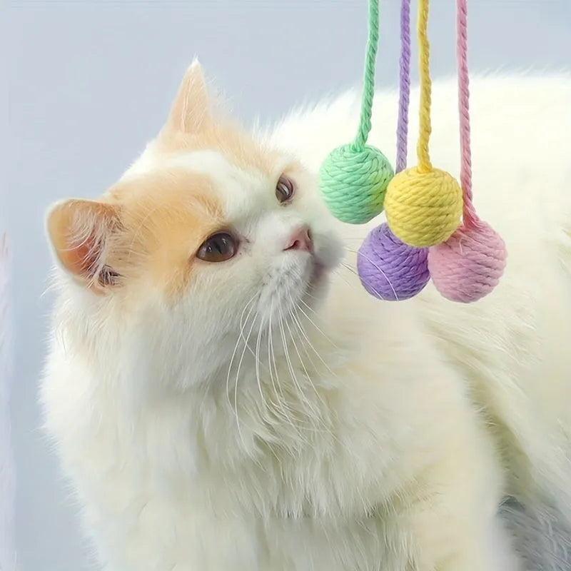 Green cat toy ball with a built-in rope and bell in a 6cm size.