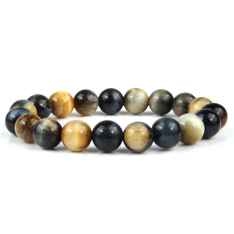 Natural tigereye crystal beaded bracelet with round beads, shown in a selection of colours and sizes on a wrist.